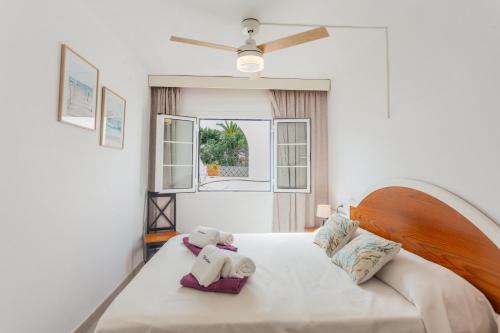 a bedroom with a bed with two stuffed animals on it at Marlena in Cala en Bosc