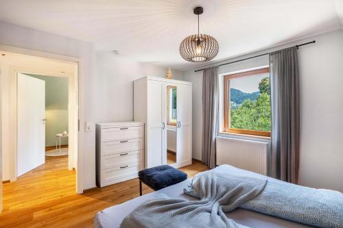 a bedroom with a bed and a window at Ferienwohnung s'Raubers in Bühlertal