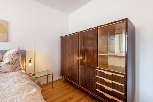a large wooden cabinet in a living room at bei Stefanie in Bad Koetzting