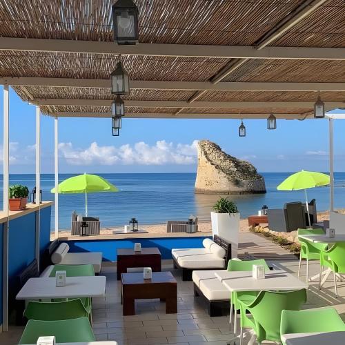 a restaurant with a view of the ocean at Villetta Lucy in Salve