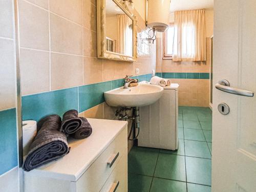 a bathroom with a sink and a toilet and a sink at La Pergola al Cavo 5 in Cavo