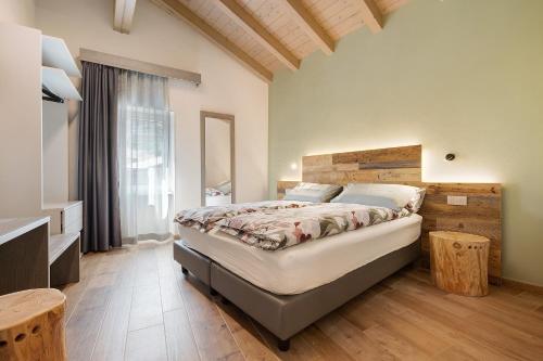 a bedroom with a large bed and a window at Casa Donati Lucia in Tremosine Sul Garda