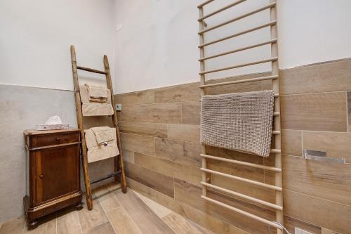 a room with a wooden wall with a ladder at Casa Donati Lucia in Tremosine Sul Garda