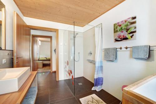 a bathroom with a shower and a sink at Joshof Bergblick in Moso