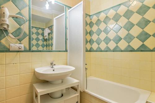 a bathroom with a sink and a shower and a tub at Mi Ilusión in Grazalema
