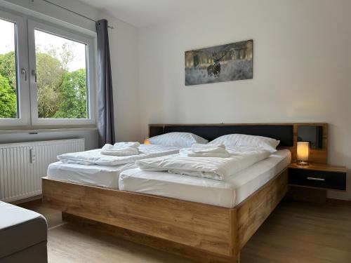 a bedroom with two beds and a window at Fewo A6 mit Sauna und Fitnessraum in Oberaudorf