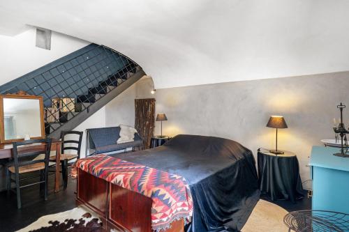 a bedroom with a bed and a stairway at Villa Cangiani in Massa Lubrense