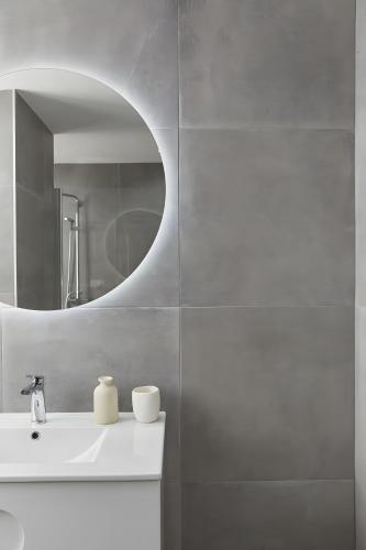 a bathroom with a white sink and a mirror at Casa Pablo City Center in Fuengirola