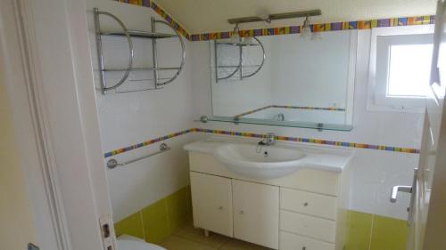 a bathroom with a sink and a toilet at Playa de las Americas Cool Duplex in Playa de las Americas