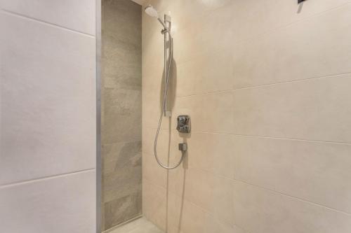 a shower with a shower head in a bathroom at Luisalle Top 3 in Auffach