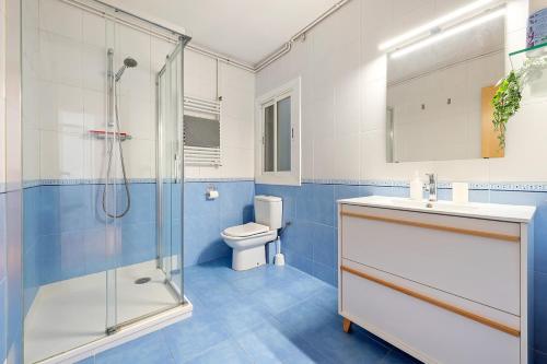 a bathroom with a shower and a sink and a toilet at Center Beach Calafell in Calafell