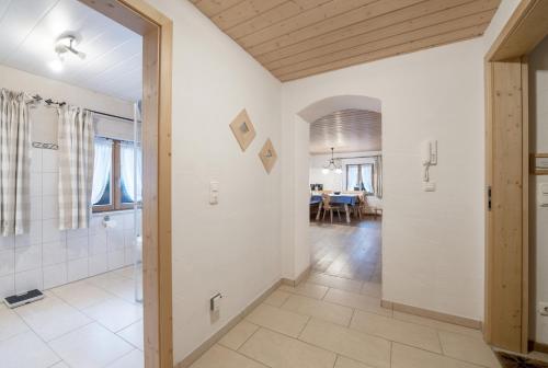 an open bathroom with a shower and a dining room at Ferienwohnung Waxenstein in Grainau