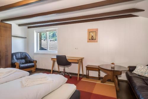 a living room with a couch and a table at Ferienhaus Villa Kanisblick in Bizau