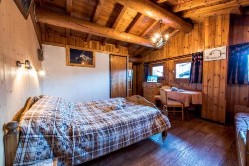 Llit o llits en una habitació de Le Rhododendron