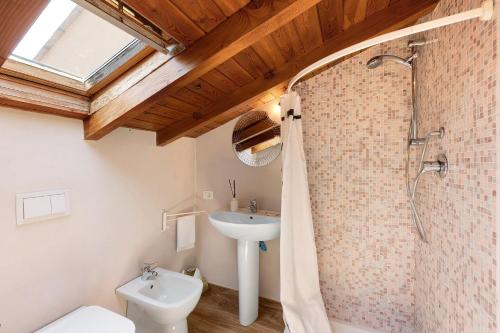a bathroom with a shower and a sink at Casabianca - The best for bikers in Finale Ligure