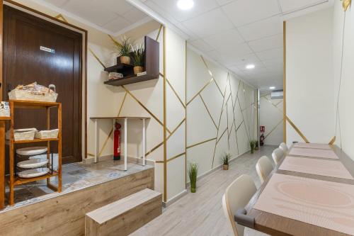 a conference room with a table and chairs at 7A Hostal in Torrevieja