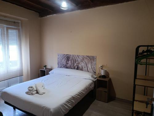 a bedroom with a bed with two teddy bears on it at Casa Adelina in Foz