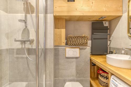 a bathroom with a shower and a sink at Appartement Alpe d'huez in LʼHuez