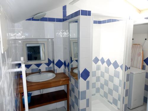 a bathroom with a sink and a mirror at Domaine de Chante-Oiseau - 34 pers in Theil-Rabier