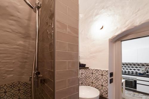 a bathroom with a shower with a toilet and a sink at Magia e Luce in Sanremo