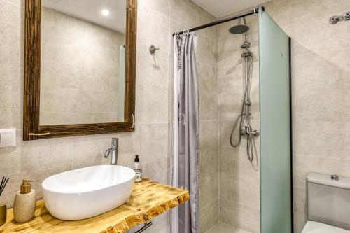 a bathroom with a sink and a shower at El Figuerar in Palamós