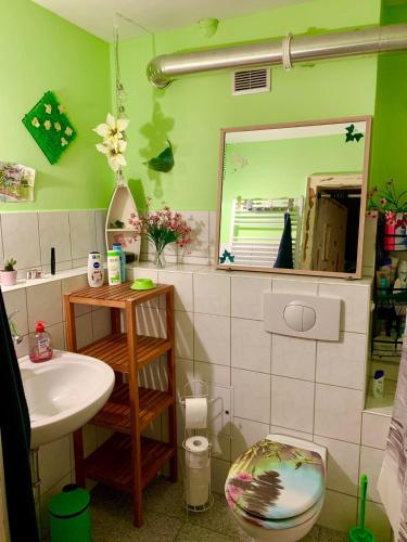 a bathroom with a sink and a mirror at Am Weinberg Kassel Gästezimmer in Kassel