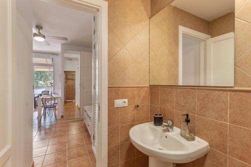a bathroom with a sink and a mirror at Vv Faro in Puerto de Mogán