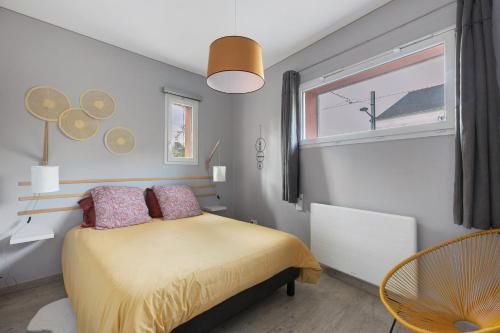 a small bedroom with a bed and a window at A L'orée D'angers - Terra Botanica in Avrillé