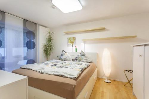 a bedroom with a large bed in a room at Ferienwohnung Zur Quelle in Plettenberg