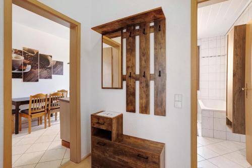 a kitchen and dining room with a sink and a table at Ferienwohnung Spree - Oase in Spremberg