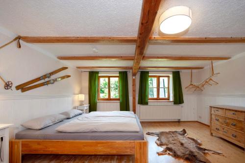 a bedroom with a bed in a room at Alpenchalet Pfronten in Pfronten