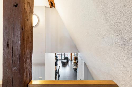 a long hallway with white walls and a ceiling at Bacchus Holiday Homes in Bacharach