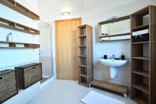 a bathroom with a sink and a mirror at Luxury Guesthouse Pula in Pula