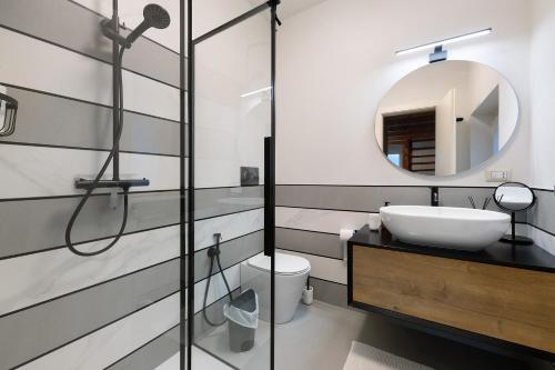 a bathroom with a sink and a mirror at Lake Como - Incanto in Valvarrone