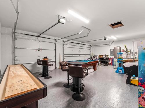 a garage with a ping pong table in it at Waterfront Haven with Pool Spa Game Room in Port Charlotte
