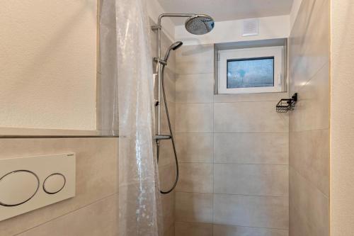 a bathroom with a shower with a shower curtain at Stegmann Horn in Gaienhofen
