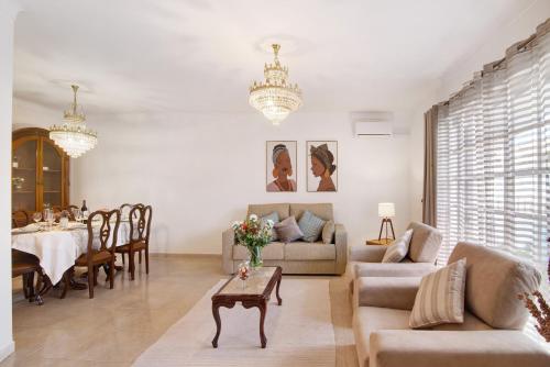 a living room with a couch and a table at Casa Judite in Lagoa