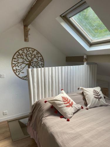 a bedroom with a large bed with a window at Maison Gaia in Valdeblore