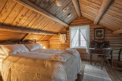 a bedroom with a bed in a wooden house at Thon Hotel Sortland in Sortland