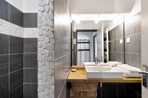 a bathroom with a sink and a mirror at Chalet Pla Del Mir in Les Angles