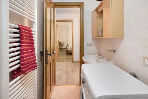 a bathroom with a sink and a toilet in it at Appartamento Vacanze Matteo in Livigno
