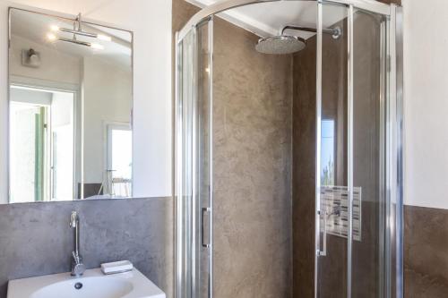 a bathroom with a sink and a shower at Il Pescino in Pietrasanta