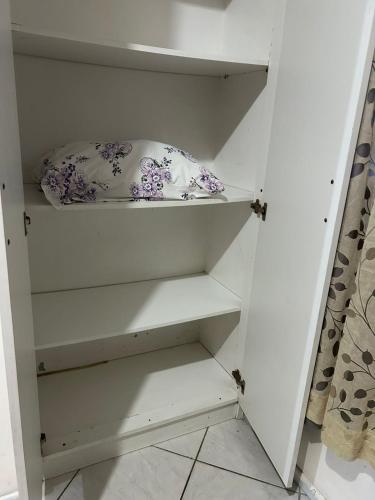 a white cupboard with a pillow on it at Vila do Chaves Prof Girafales 15 in Itajaí