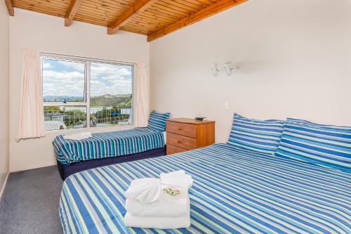 Ein Bett oder Betten in einem Zimmer der Unterkunft Aloha Seaview Resort Motel