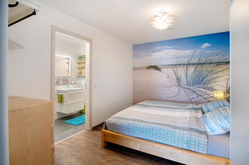 a bedroom with a bed and a bathroom at Ferienwohnung mit eigenem Eingang in Deggenhausertal