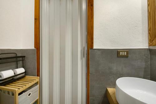 a bathroom with a white shower and a sink at Maison Olga - La Roisette in Valtournenche