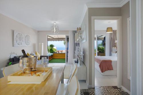 a living room and a bedroom with a bed at Casa Ana in Santa Úrsula