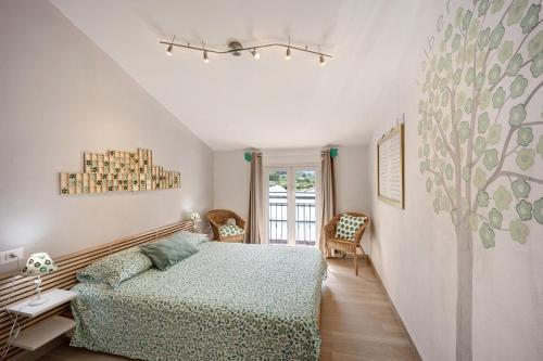 a bedroom with a bed and a window at Mansarda Albero Verde con Piscina in Casanova Lerrore