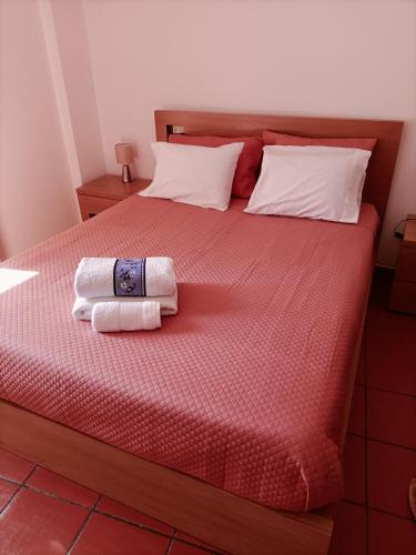 a bedroom with a bed with two towels on it at Valley T2 duplex in Vila Nova de Foz Coa
