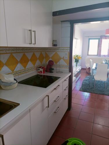 a kitchen with a sink and a counter top at Valley T2 duplex in Vila Nova de Foz Coa